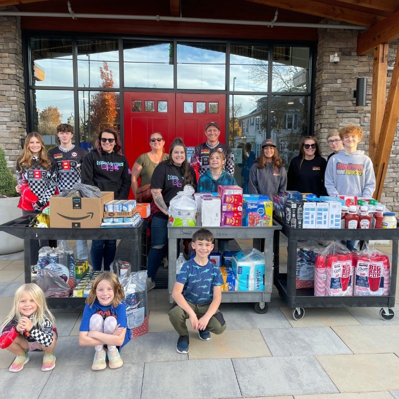 Group Donating Goods to the House