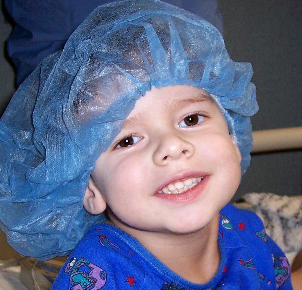 Kid with hair net on in the hospital